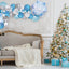 Decorated living room with Christmas tree, balloons, and presents.