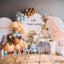 Birthday party setup with balloons, a giraffe decoration, and '10th Happy Birthday Baby' sign.