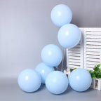 Light blue balloons arranged in a cluster on a neutral background