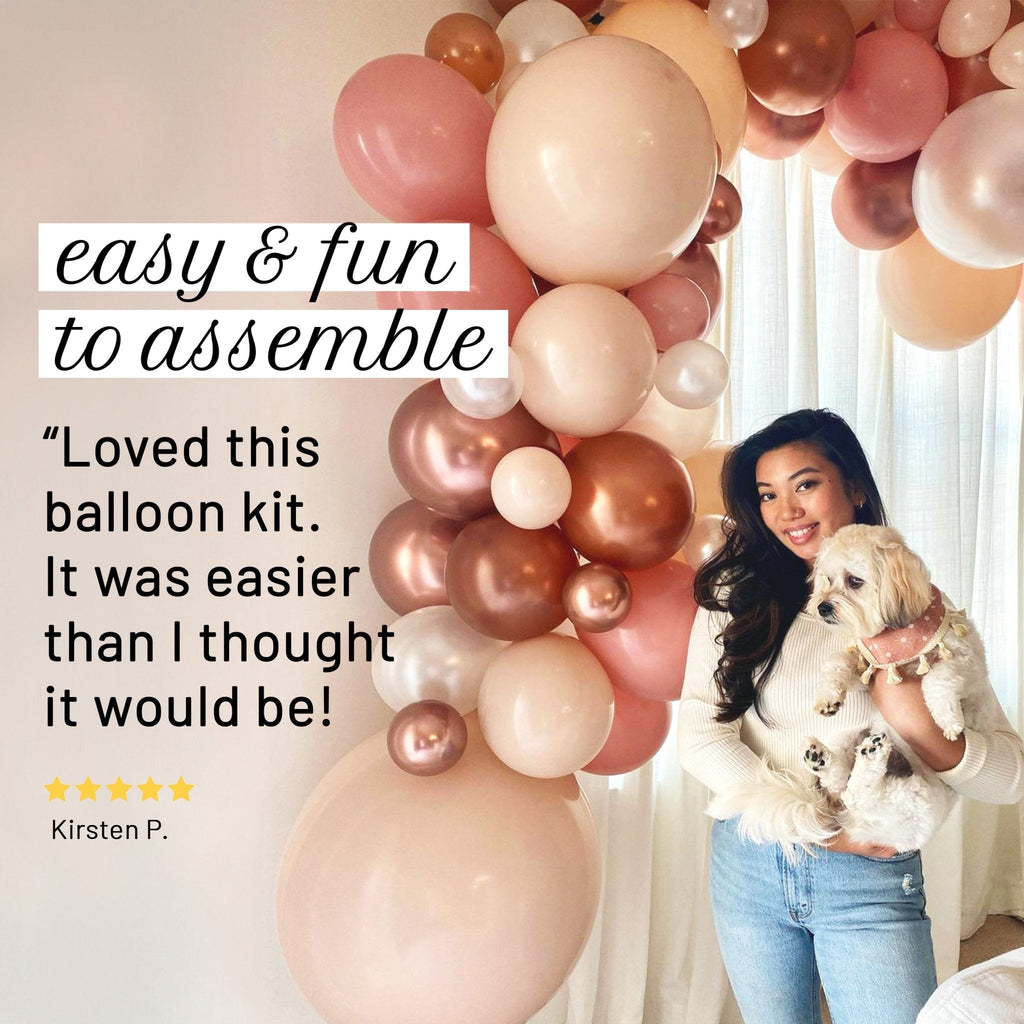 Woman holding a dog in front of a balloon arch with text about the balloon kit's ease of assembly.