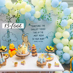Children's birthday party setup with balloons, cake, and Winnie the Pooh decorations.
