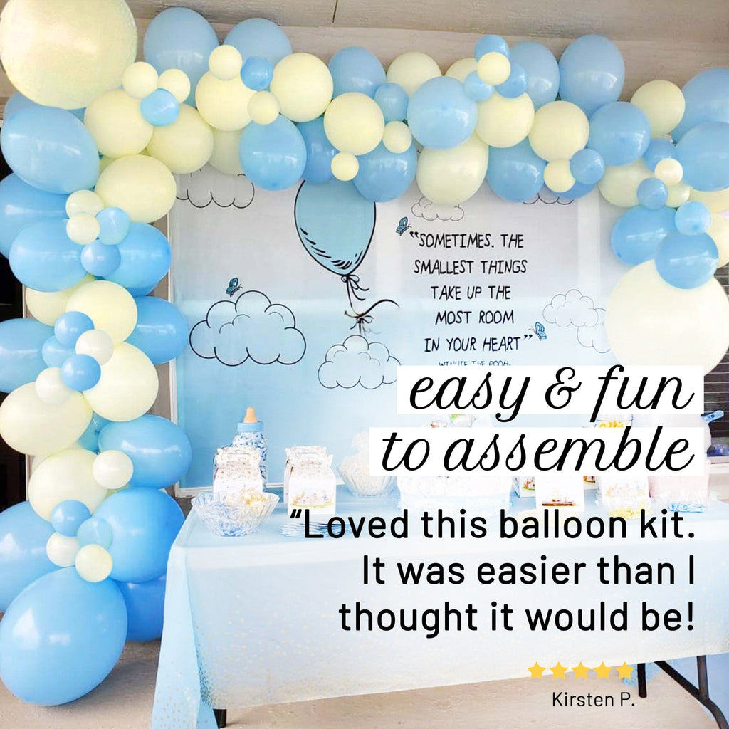 Balloon arch with blue and white balloons and a sign about the balloon kit.