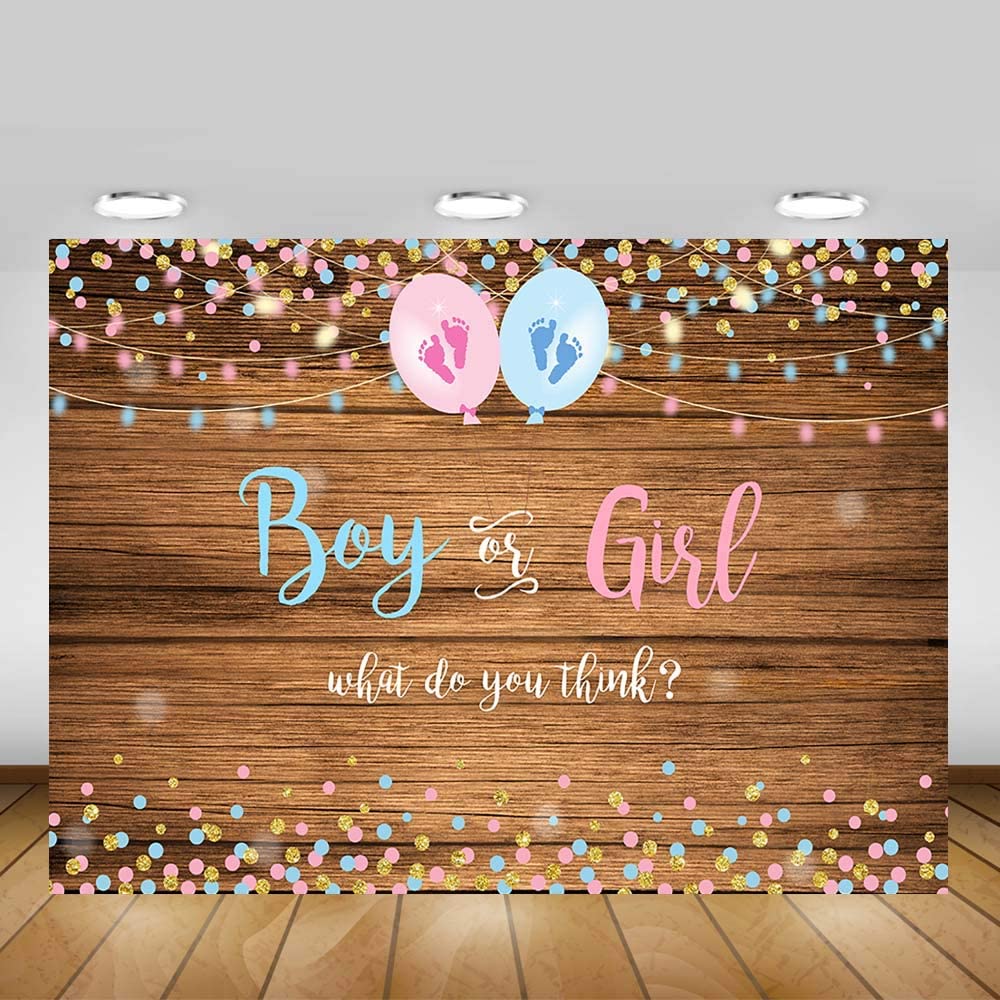 Gender reveal backdrop with 'Boy or Girl' question and balloons on a wooden background