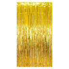 Gold metallic fringe tinsel curtain backdrop on a white background