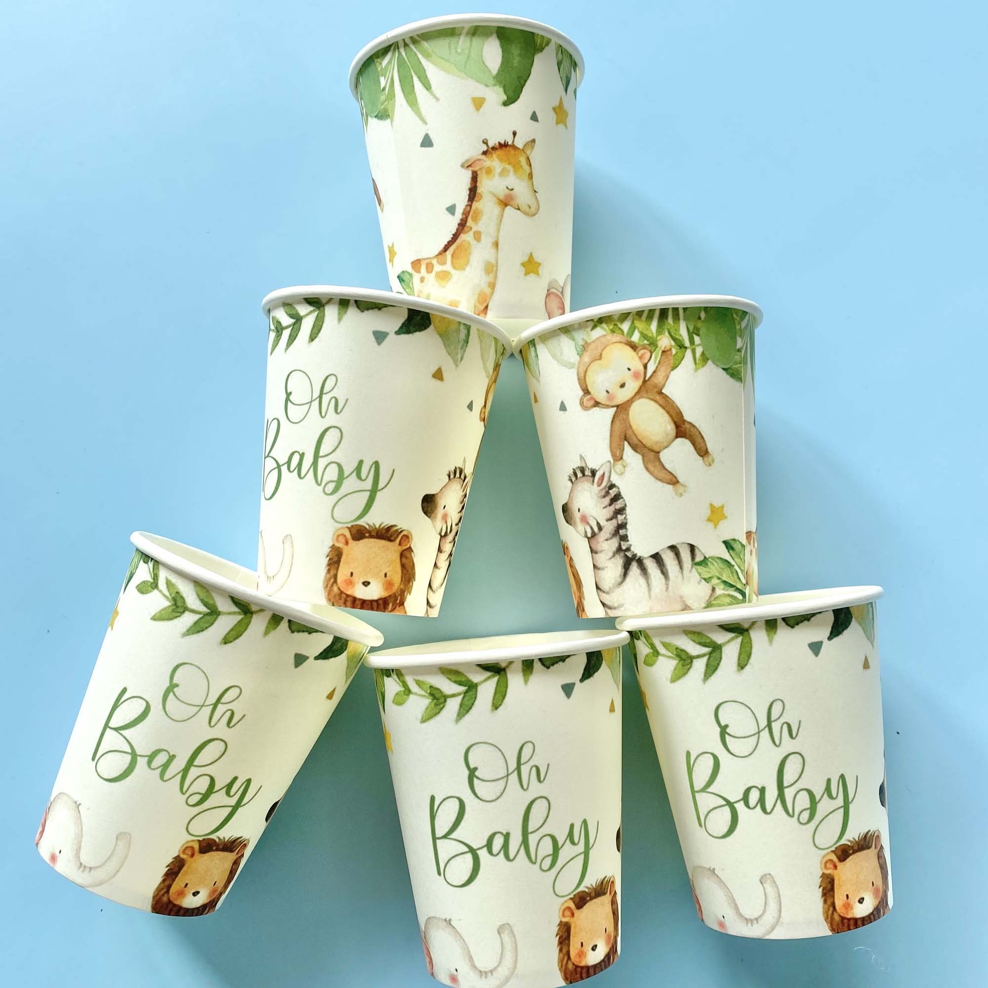 Paper cups with animal illustrations and 'Oh Baby' text on a blue background