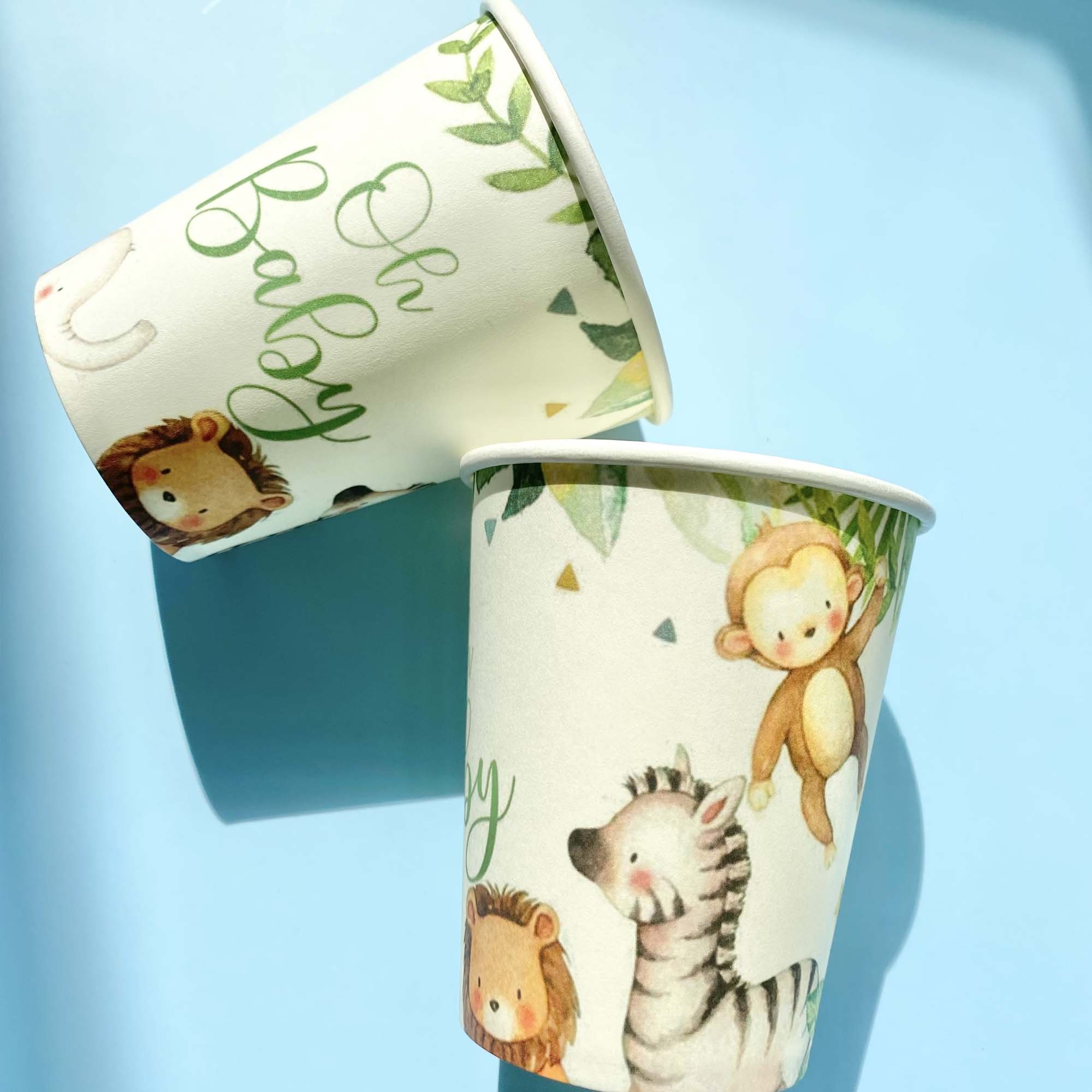 Two paper cups with animal illustrations on a light blue background
