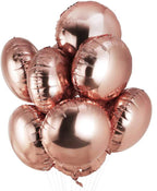 Rose gold heart-shaped balloons on a white background